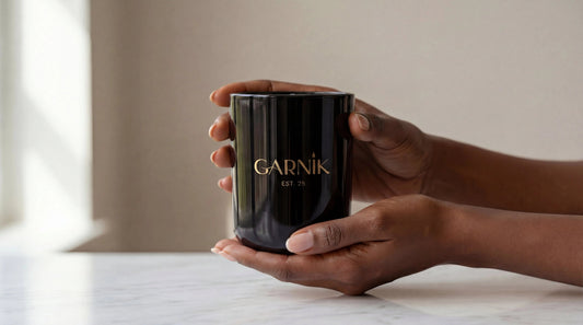 Woman's hand holding Garnik Luxury Scented Candle